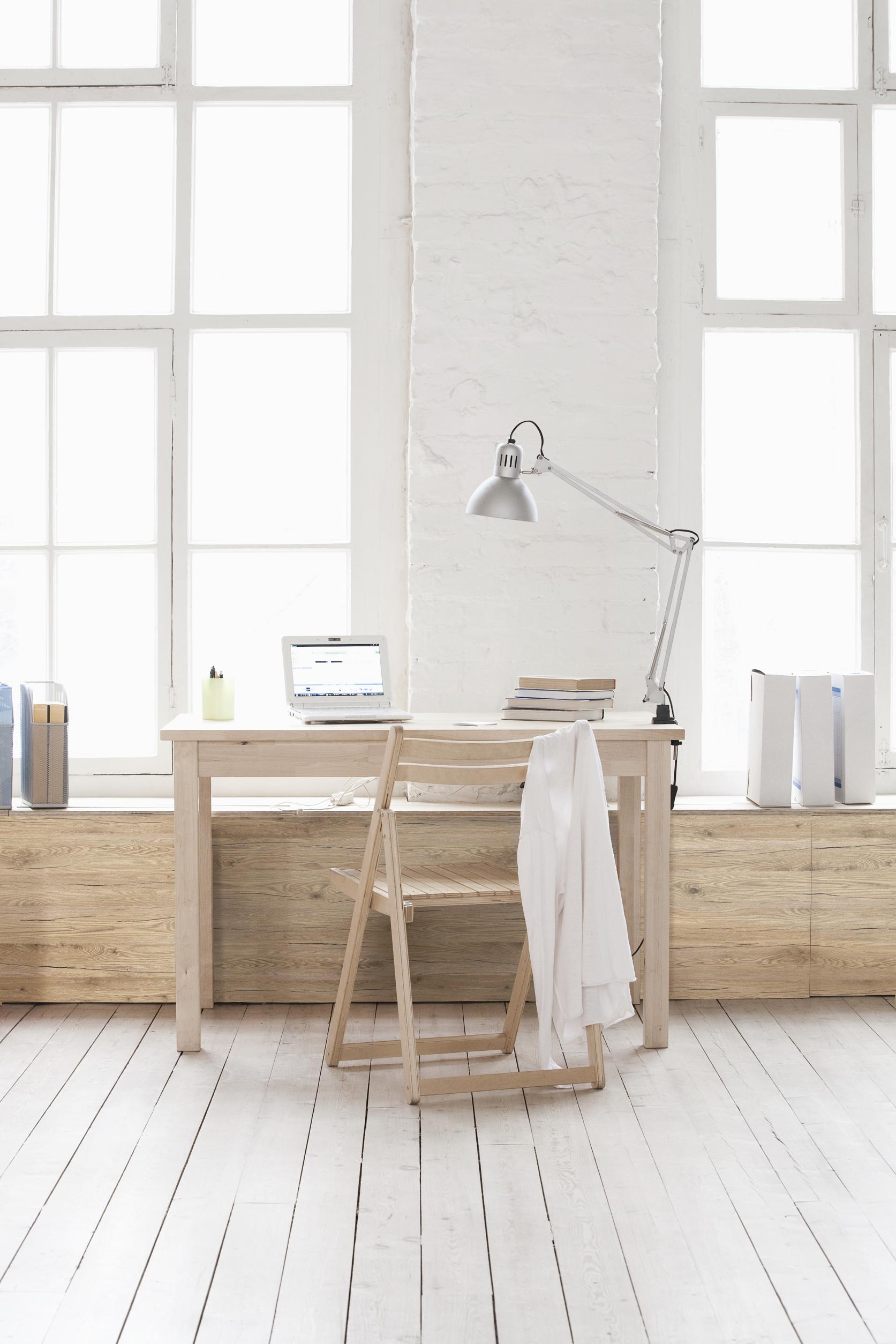 Desk in window area of loft apartment